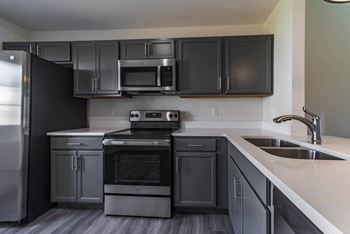 Kitchen with dark cabinets